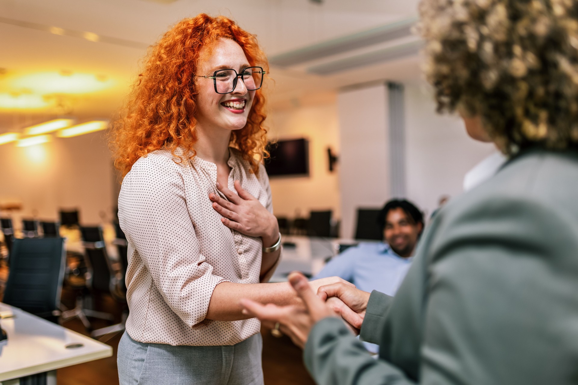 African American woman from Human Resource congratulates the new employee